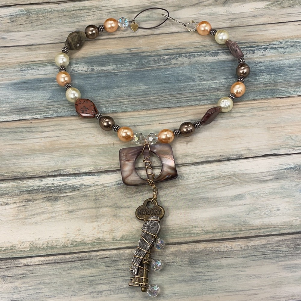 Adorned Crown Artisan assemblage shell buckle skeleton key necklace