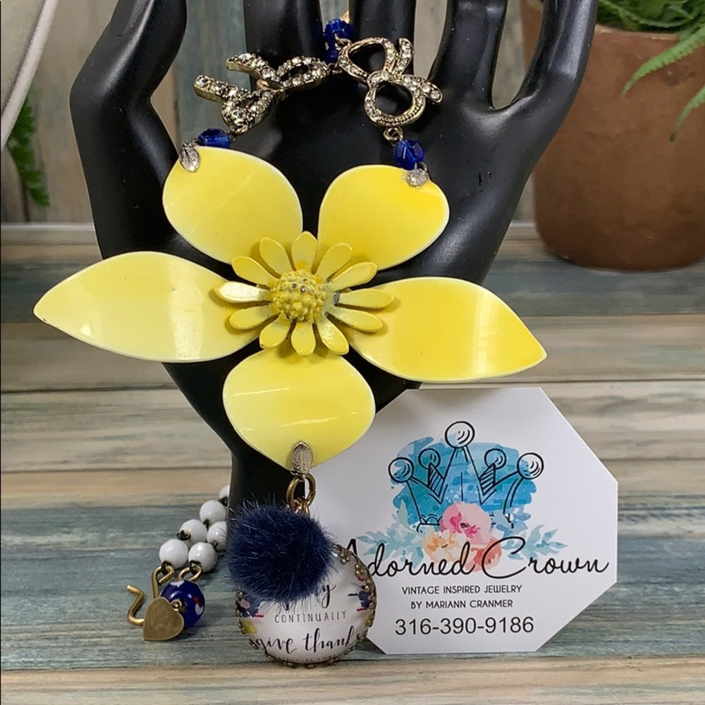 Adorned Crown artisan assemblage yellow enamel flower bow pray necklace