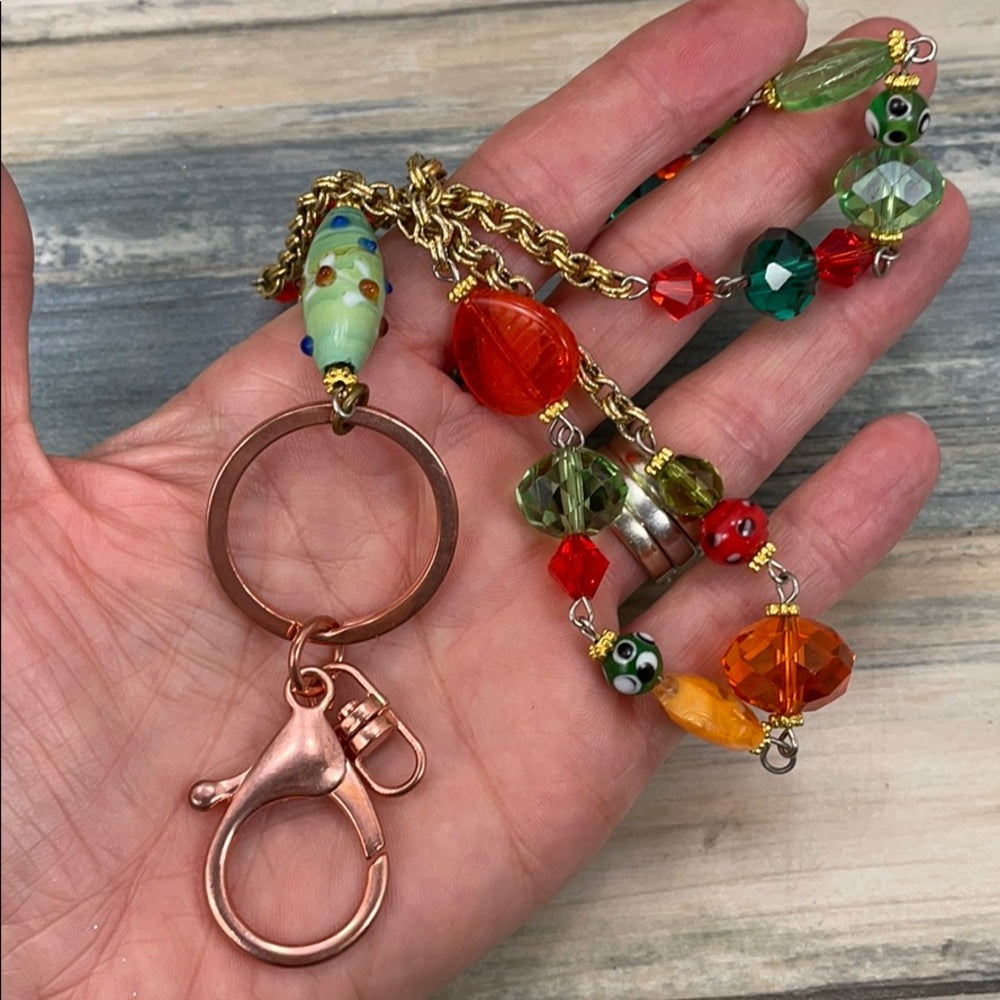 Adorned Crown assemblage orange green bead lanyard keychain badge