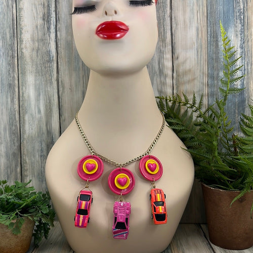 Adorned Crown artisan assemblage child’s play pink car necklace