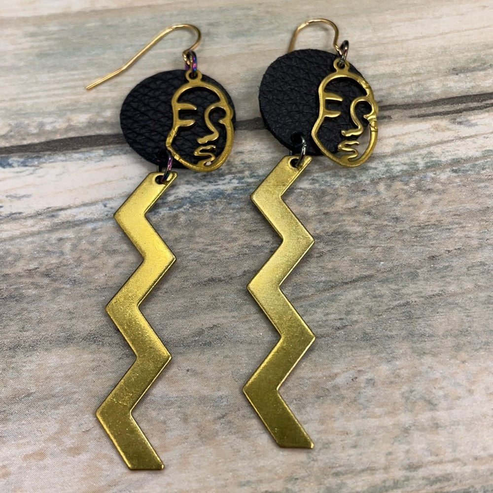 Adorned Crown geometric face zig zag leather earrings
