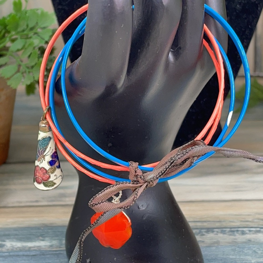 Adorned Crown assemblage blue orange bangles with charms