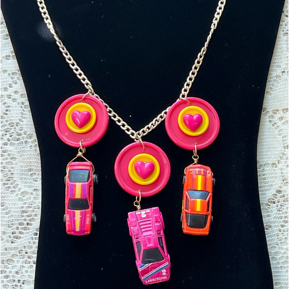 Adorned Crown artisan assemblage child’s play pink car necklace