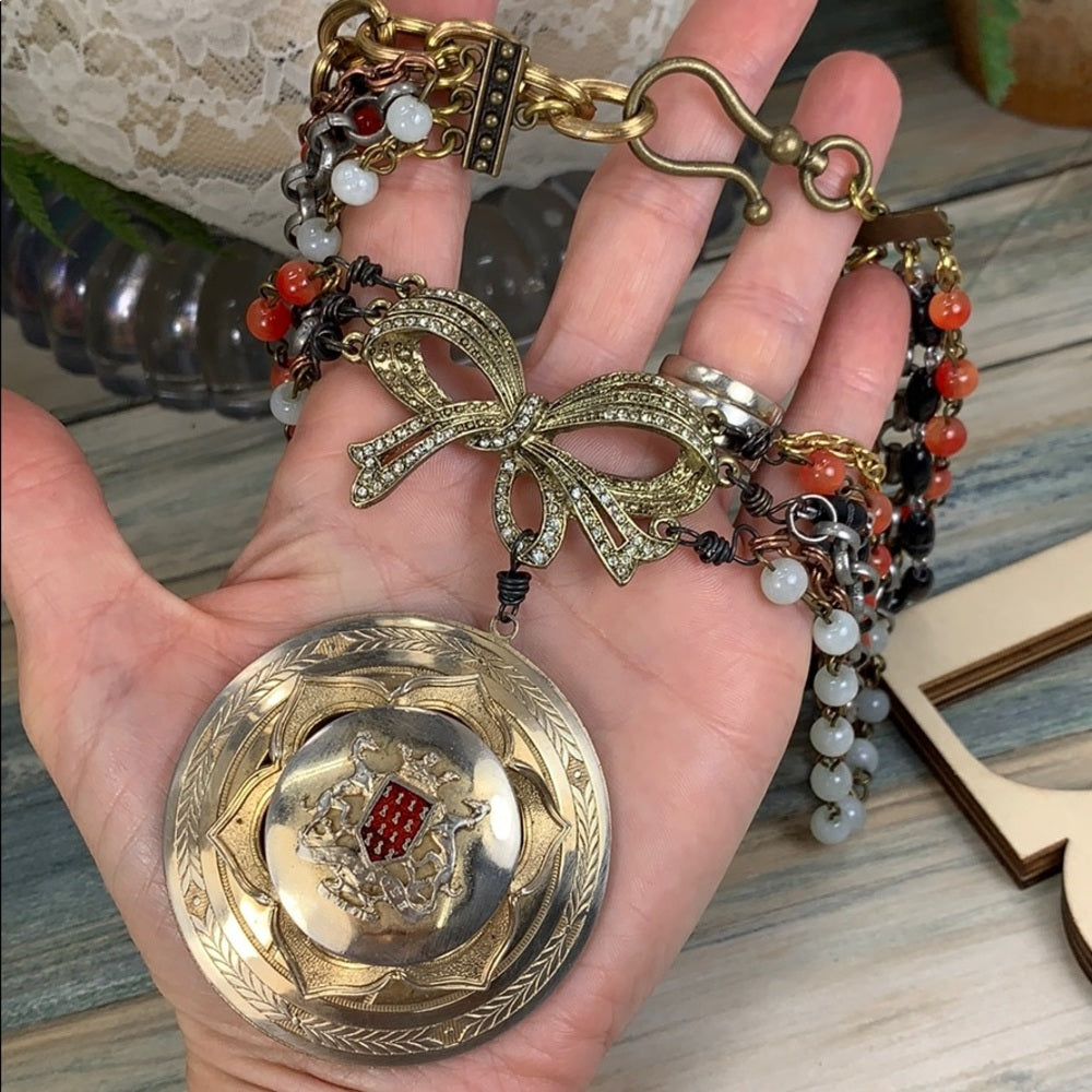 Adorned Crown Artisan assemblage shield medallion multi strand necklace
