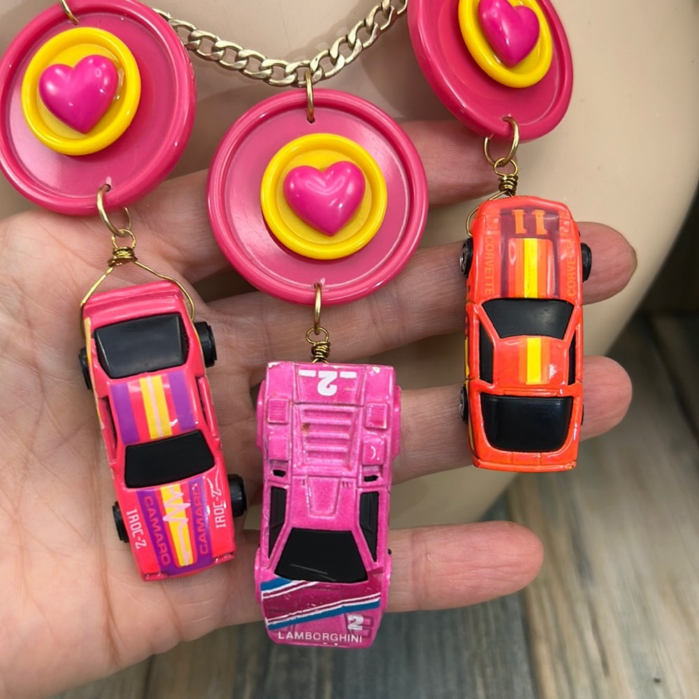 Adorned Crown artisan assemblage child’s play pink car necklace