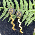 Adorned Crown geometric face zig zag leather earrings