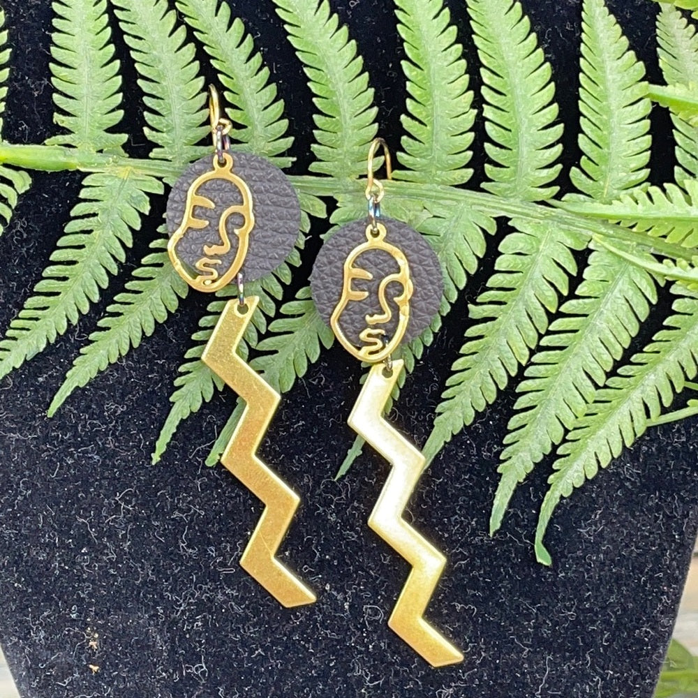 Adorned Crown geometric face zig zag leather earrings