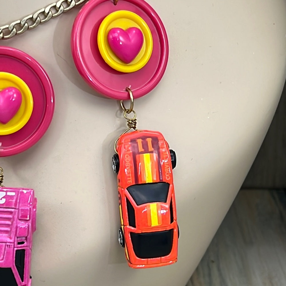 Adorned Crown artisan assemblage child’s play pink car necklace