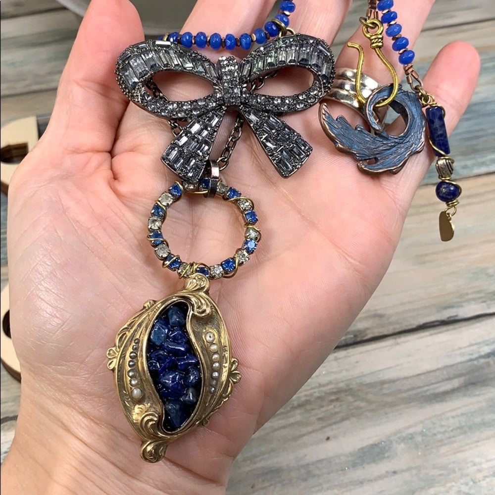 Adorned Crown artisan assemblage gold lapis rhinestone bow necklace