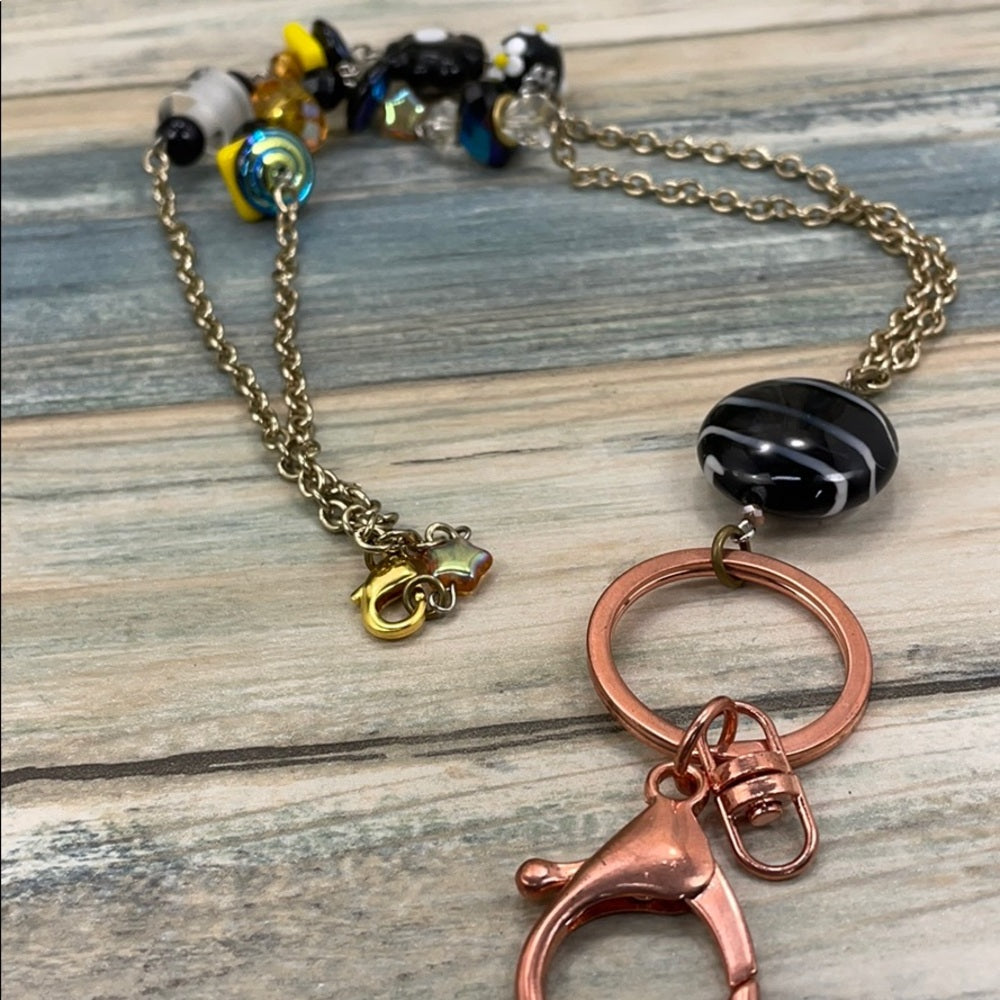 Adorned Crown assemblage black yellow bead lanyard keychain badge