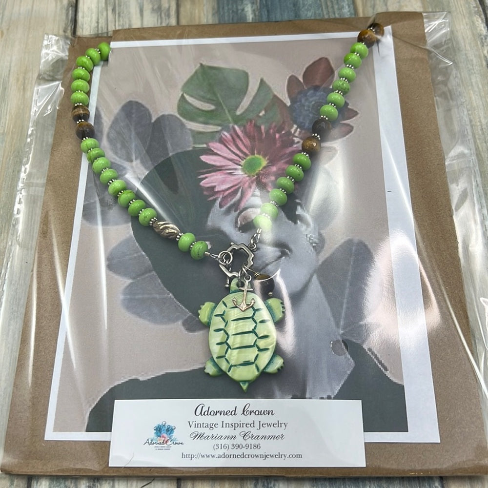 Adorned Crown Assemblage beaches & butterflies turtle anchor necklace