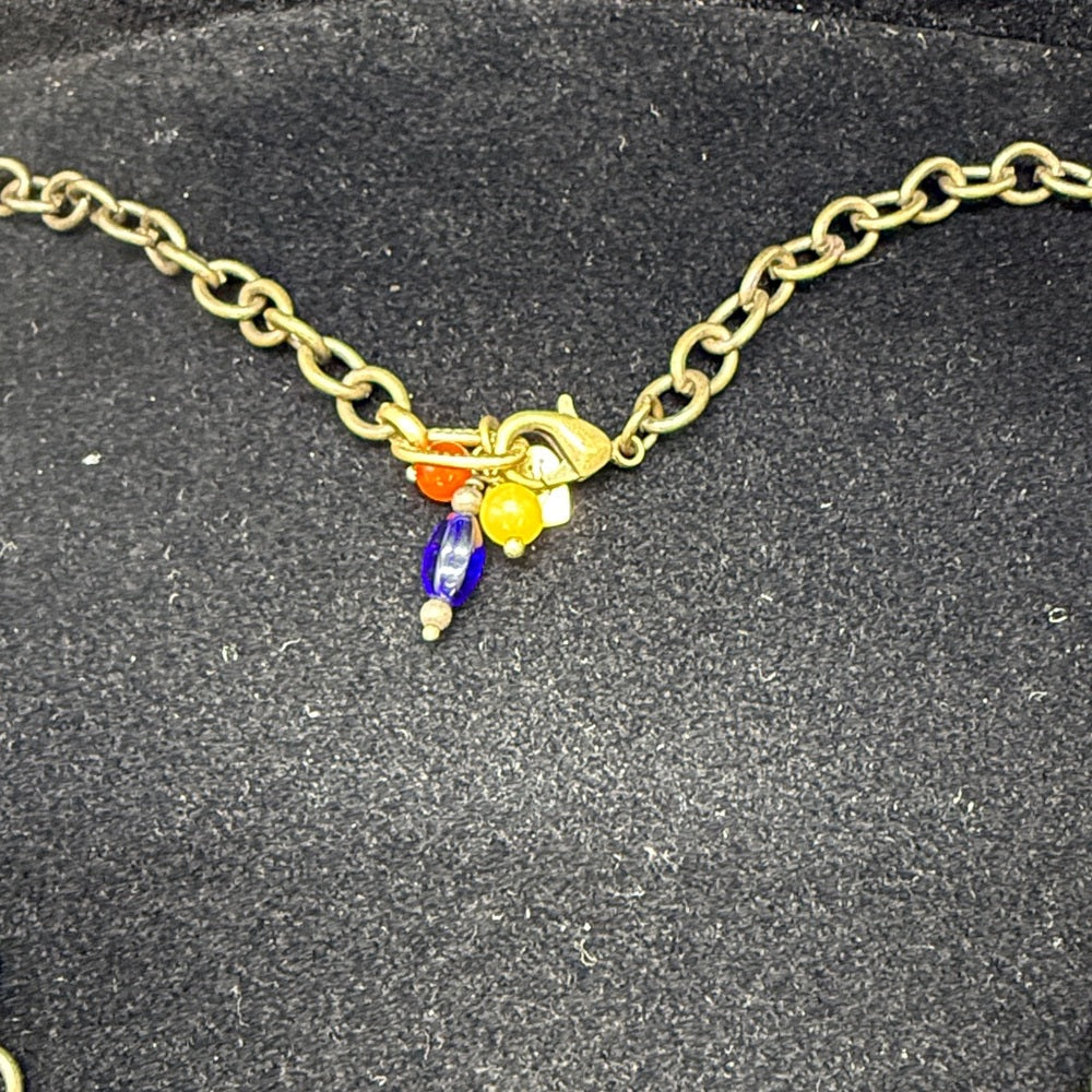Adorned Crown Jewelry assemblage yellow frame flower necklace