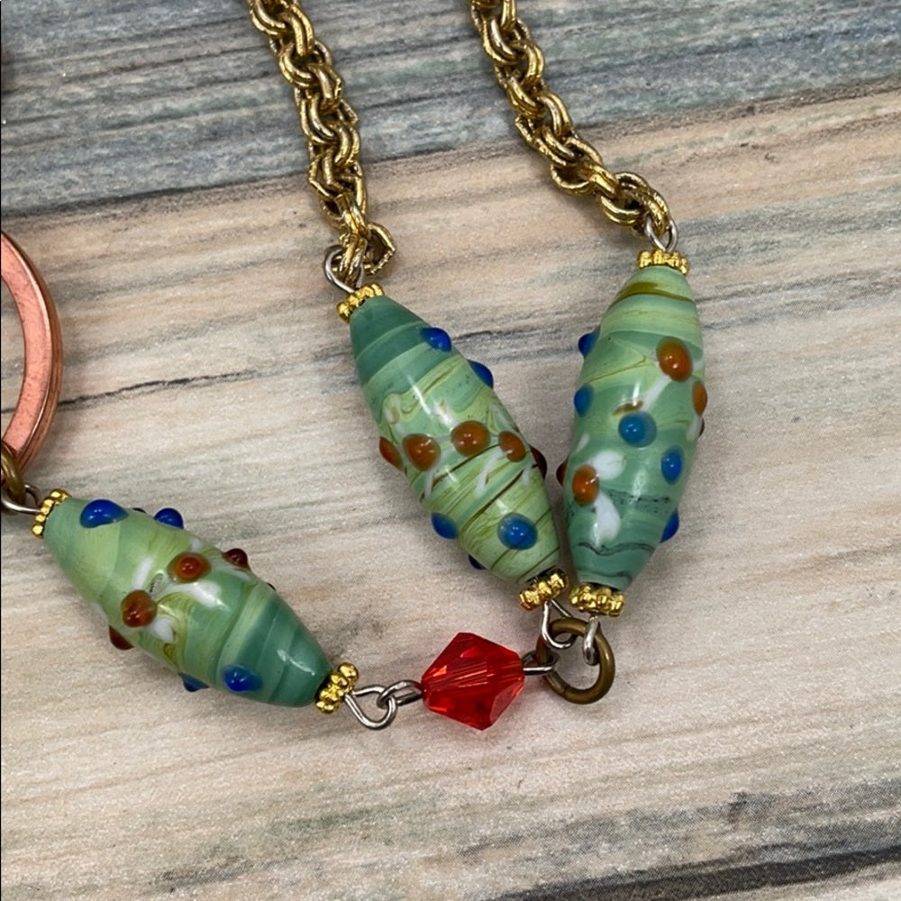 Adorned Crown assemblage orange green bead lanyard keychain badge