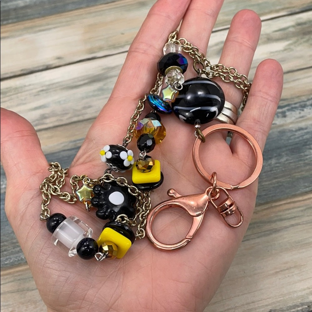 Adorned Crown assemblage black yellow bead lanyard keychain badge