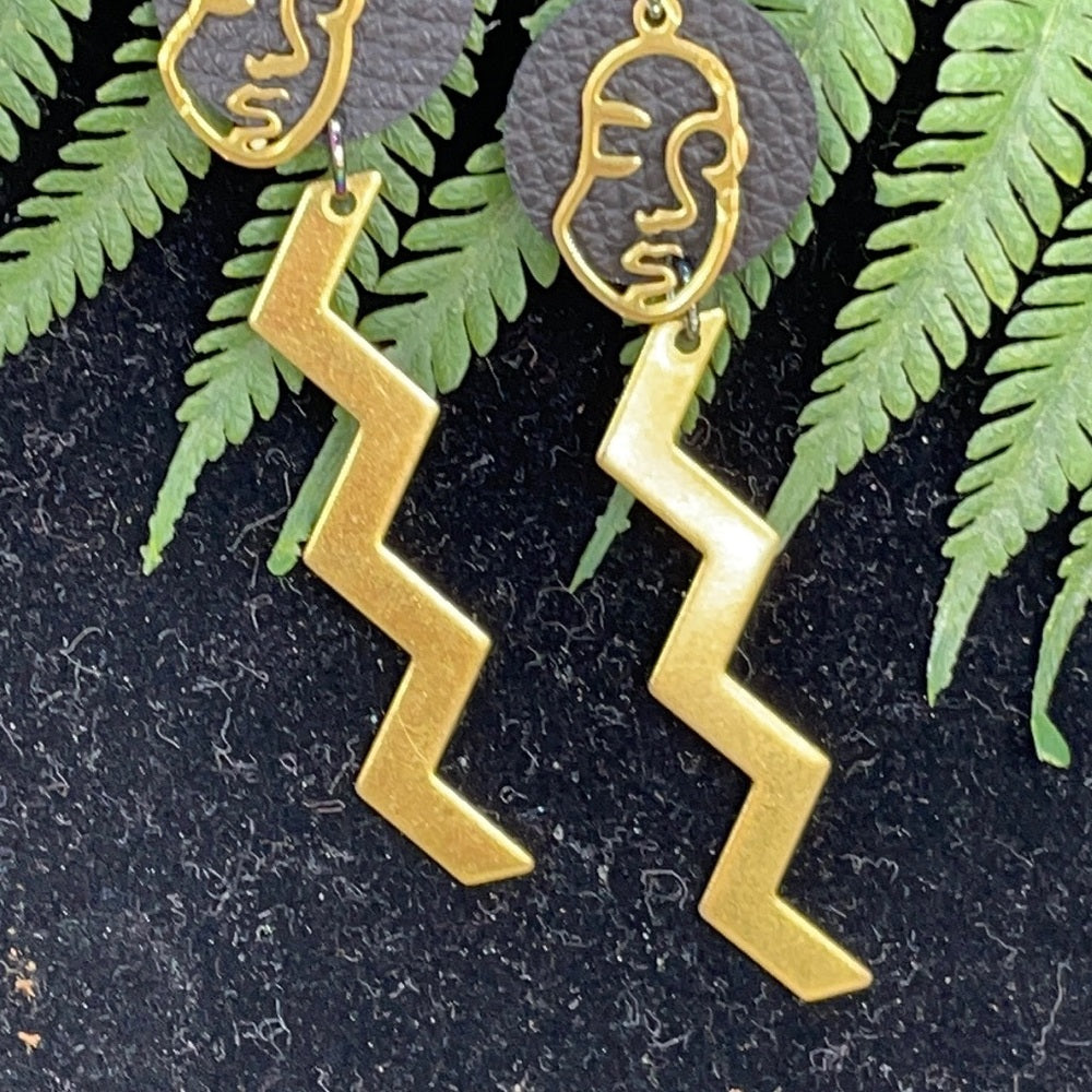 Adorned Crown geometric face zig zag leather earrings