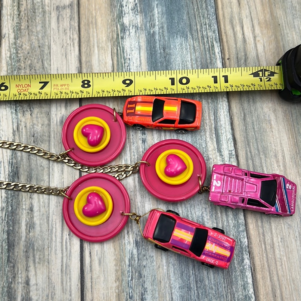 Adorned Crown artisan assemblage child’s play pink car necklace