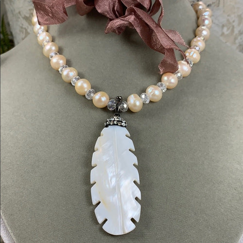 Adorned Crown artisan assemblage carved shell feather pearl silk necklace