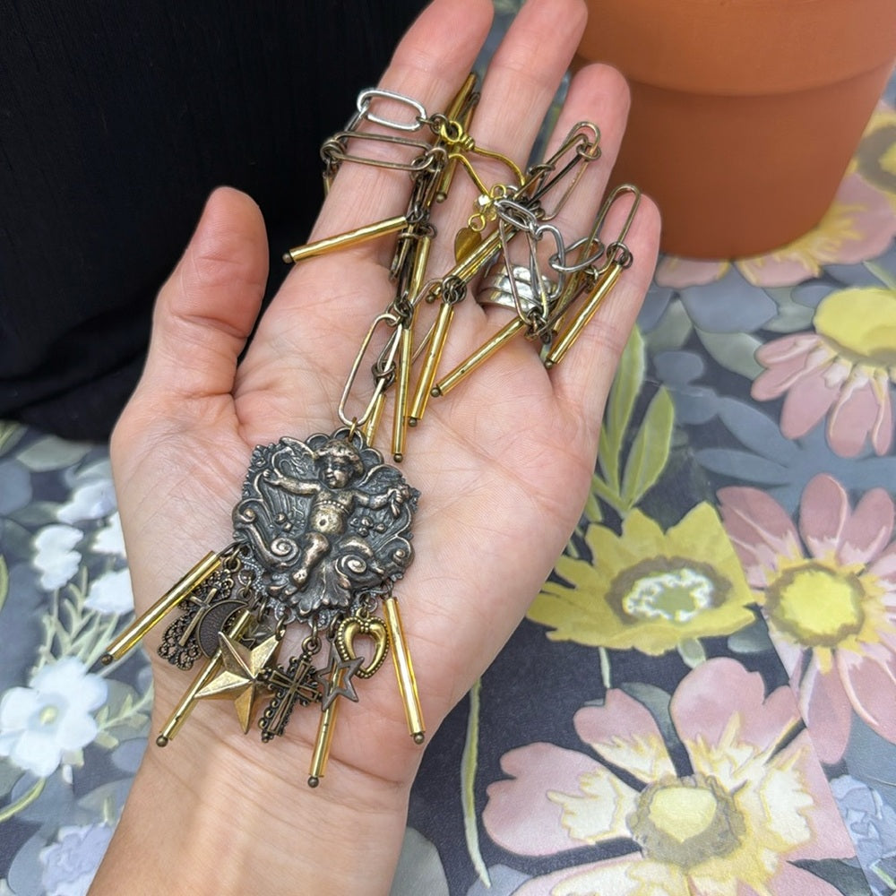 Adorned Crown Jewelry assemblage mixed metal cherub charm bugle necklace
