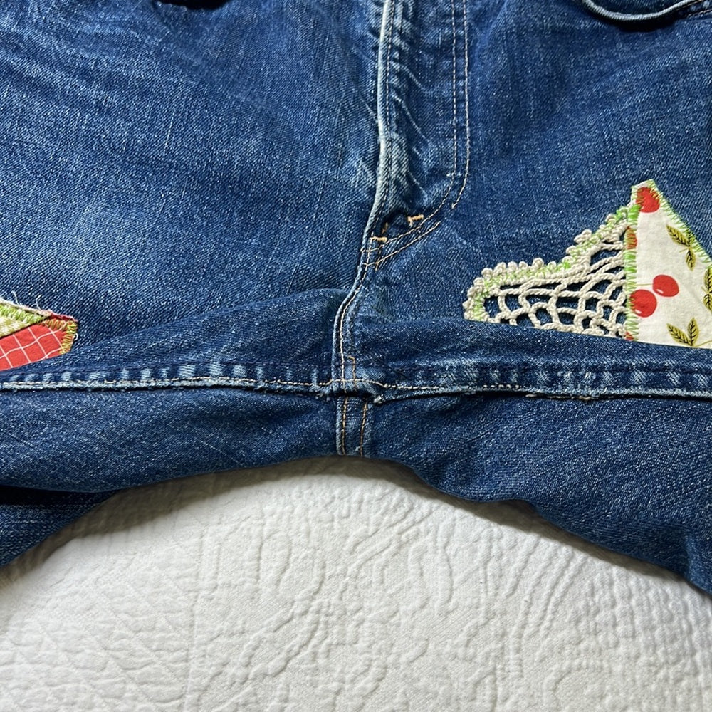 Adorned Crown Textile reworked patch Big E Levi’s cut off shorts upcycle