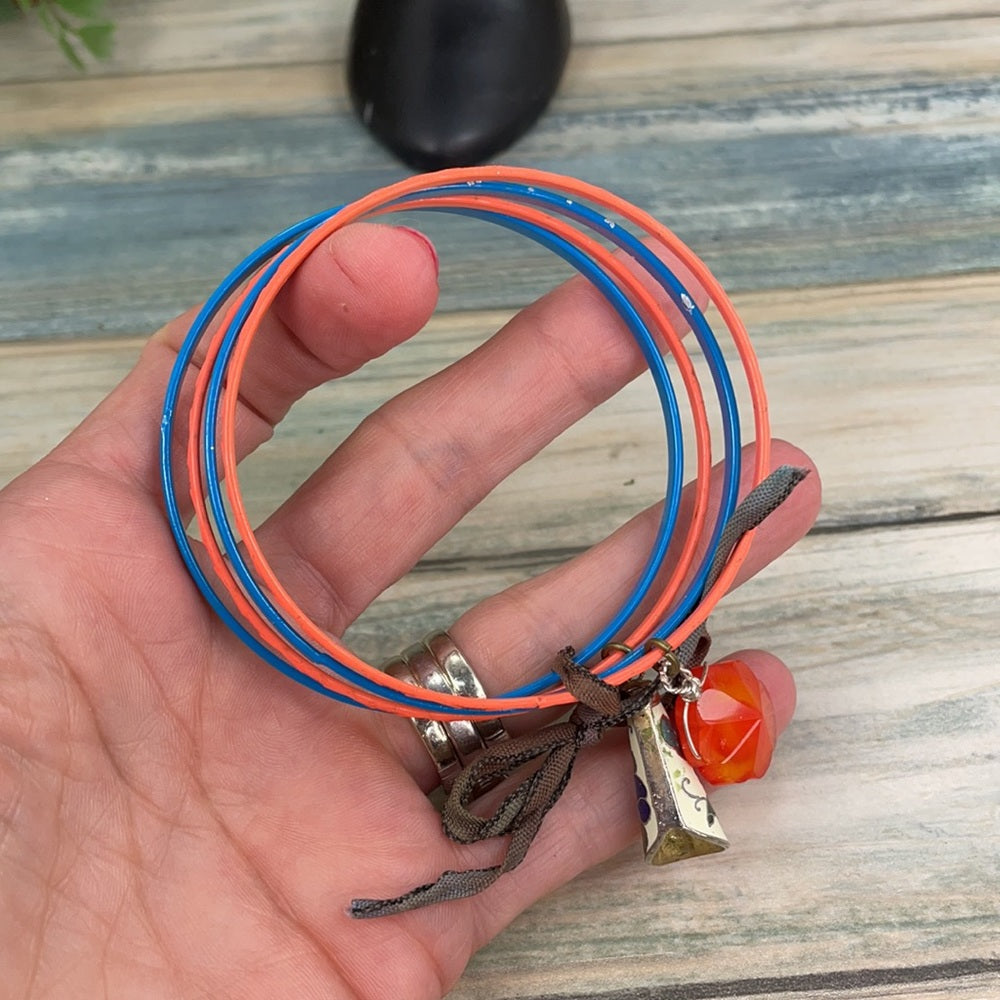Adorned Crown assemblage blue orange bangles with charms