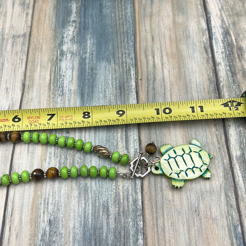 Adorned Crown Assemblage beaches & butterflies turtle anchor necklace