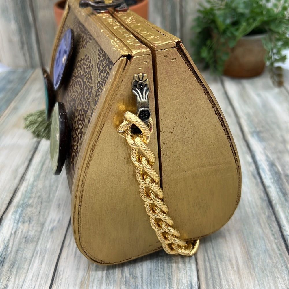 Adorned Crown Altered wood hinged big button gold handle green tassel purse