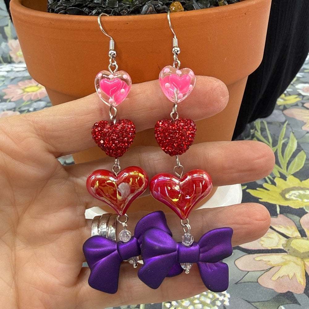 Adorned Crown Jewelry pink heart glitter red bows Valentine's Day earrings