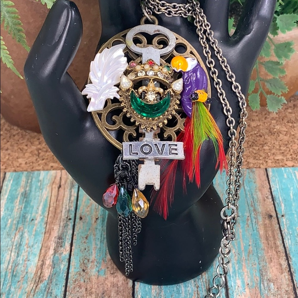 Adorned Crown artisan assemblage jungle toucan bird key cluster necklace
