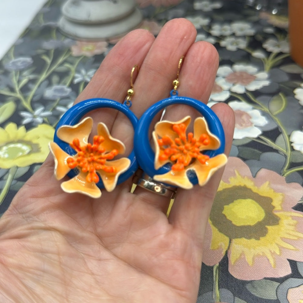 Adorned Crown orange enamel flower on neon teal circle drop earrings
