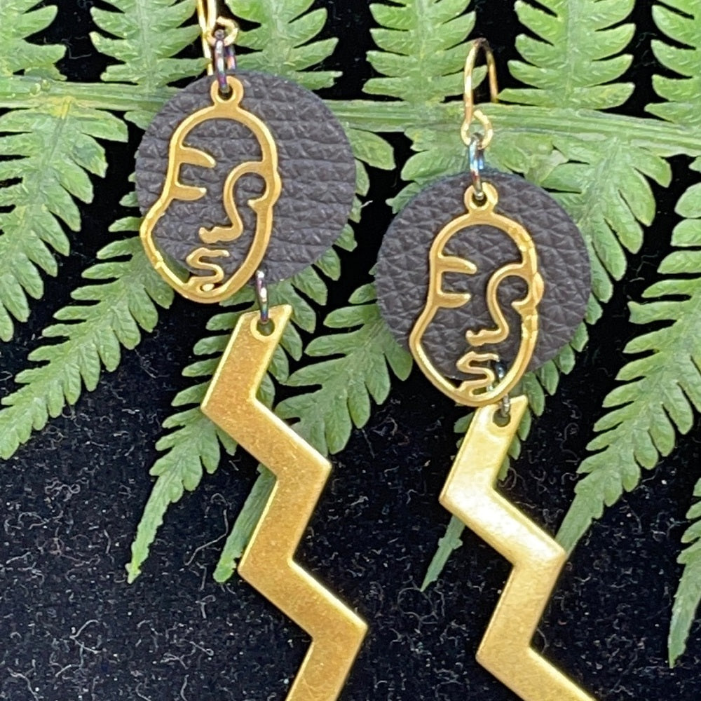 Adorned Crown geometric face zig zag leather earrings