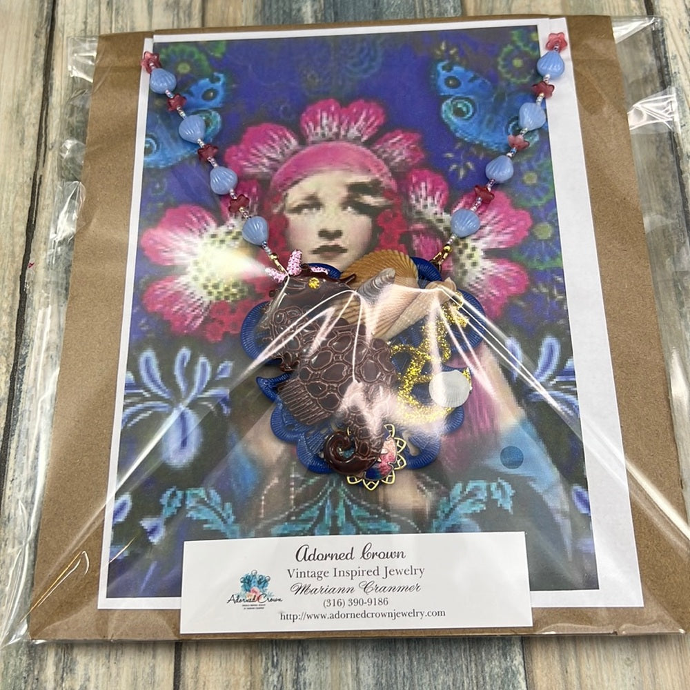 Adorned Crown Assemblage beaches & butterflies seahorse collage necklace