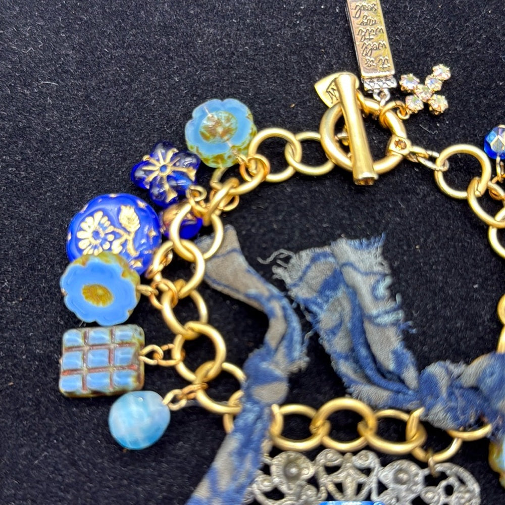 Adorned Crown Jewelry assemblage filigree shades of blue blue charm bracelet