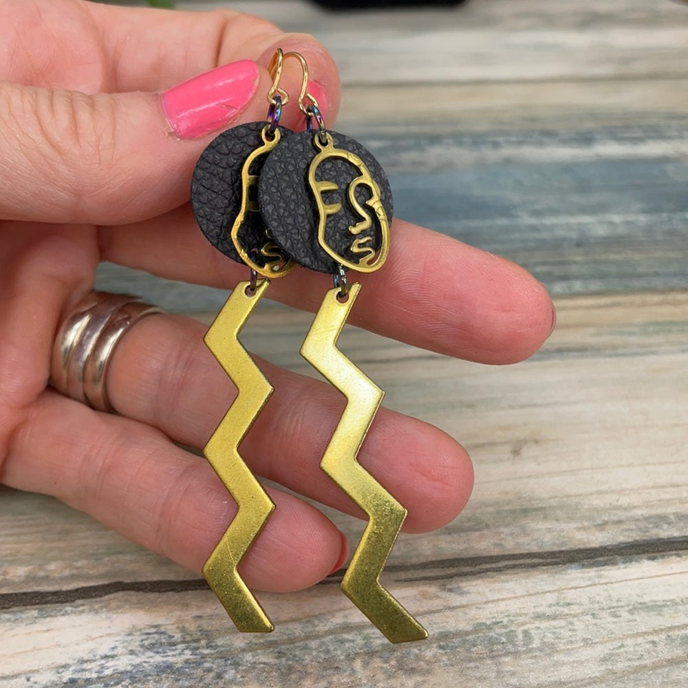 Adorned Crown geometric face zig zag leather earrings