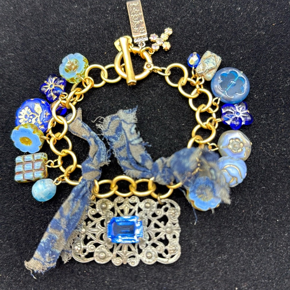 Adorned Crown Jewelry assemblage filigree shades of blue blue charm bracelet