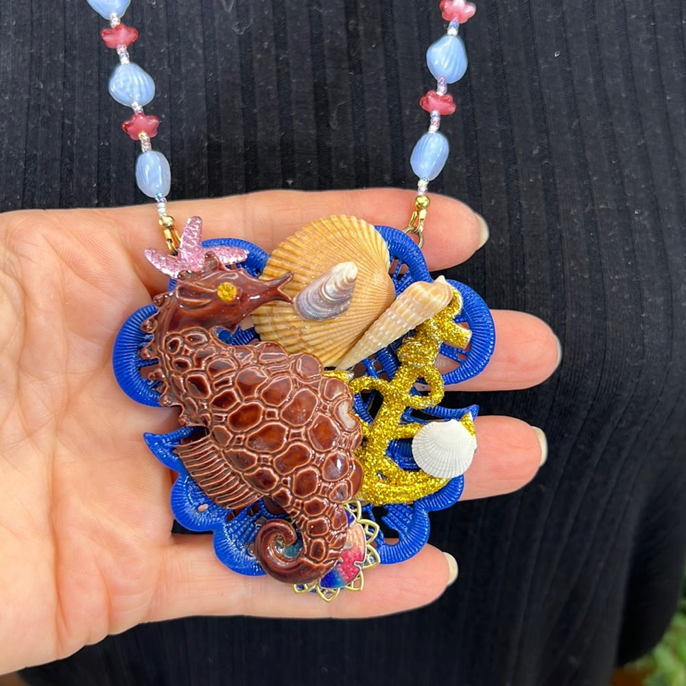 Adorned Crown Assemblage beaches & butterflies seahorse collage necklace