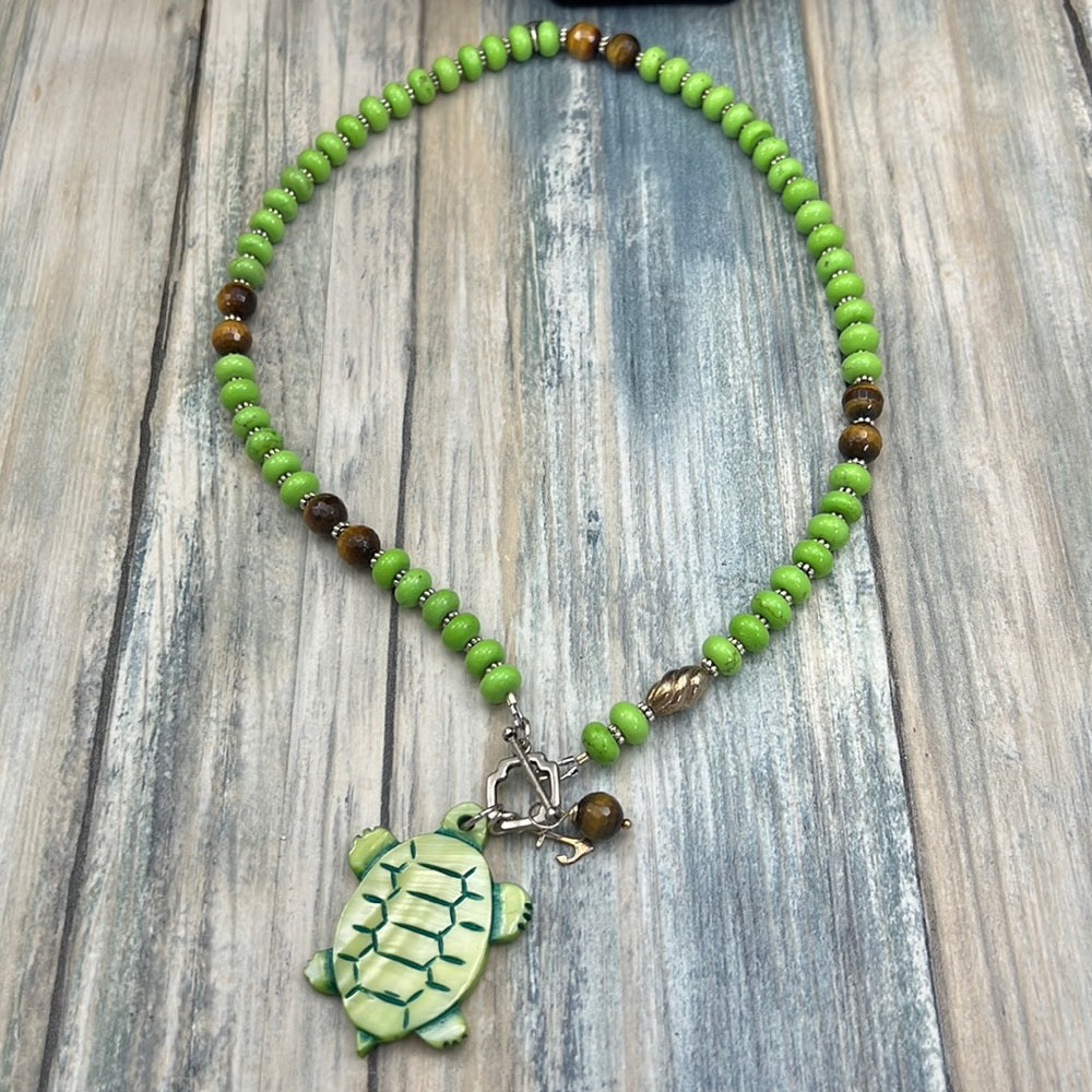 Adorned Crown Assemblage beaches & butterflies turtle anchor necklace