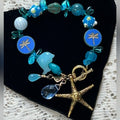 Adorned Crown Assemblage beaches & butterflies dragonfly starfish bracelet