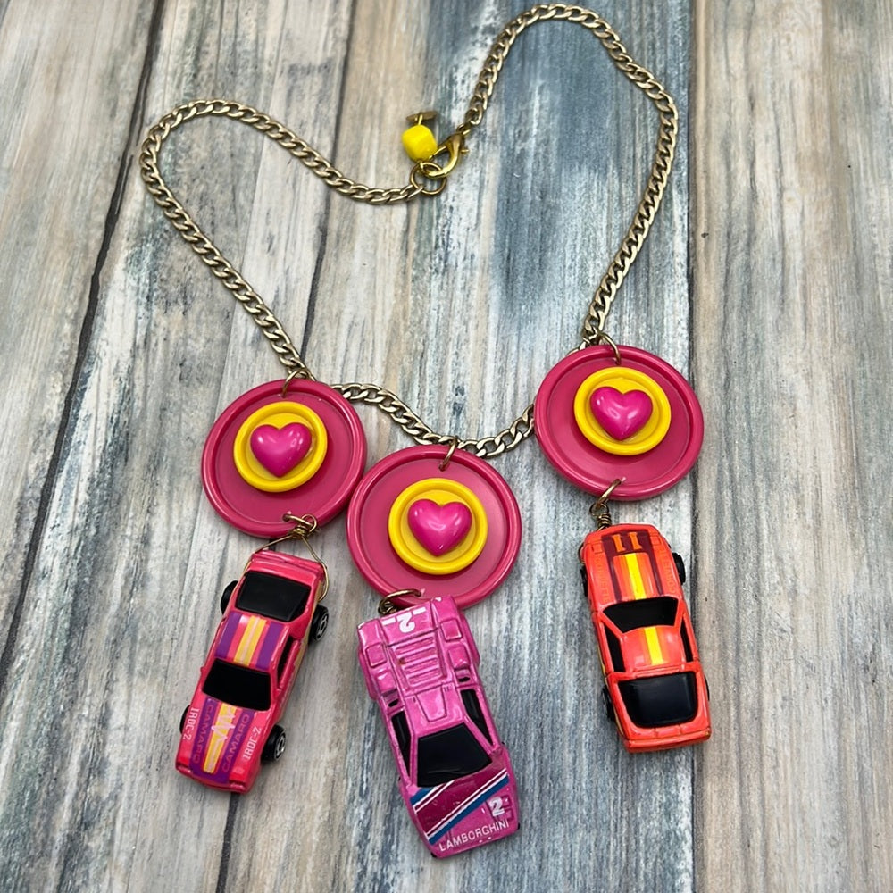 Adorned Crown artisan assemblage child’s play pink car necklace