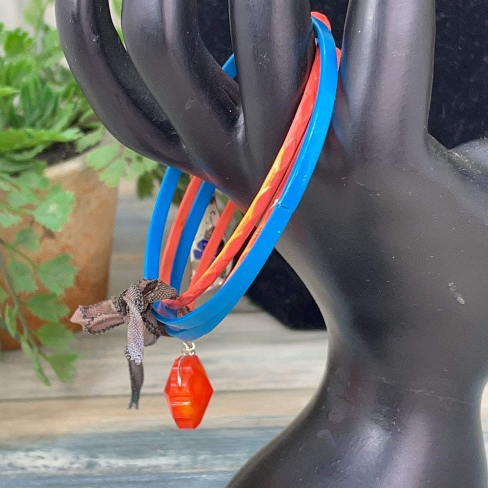 Adorned Crown assemblage blue orange bangles with charms