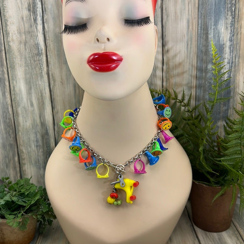 Adorned Crown artisan assemblage child’s roller skate happy face necklace