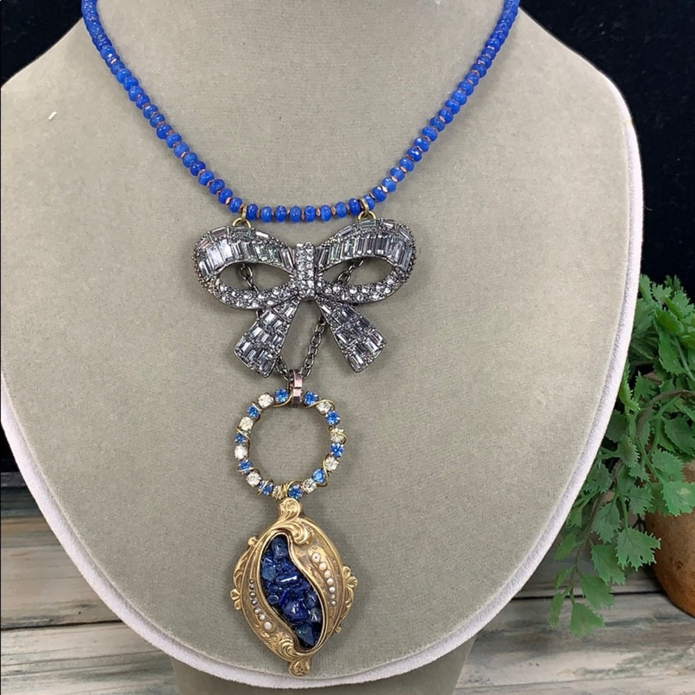 Adorned Crown artisan assemblage gold lapis rhinestone bow necklace