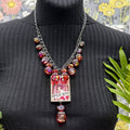 Adorned Crown Jewelry assemblage bauble Impulse buyer glass bezel necklace