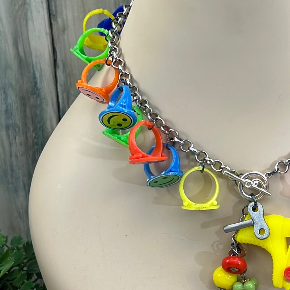 Adorned Crown artisan assemblage child’s roller skate happy face necklace