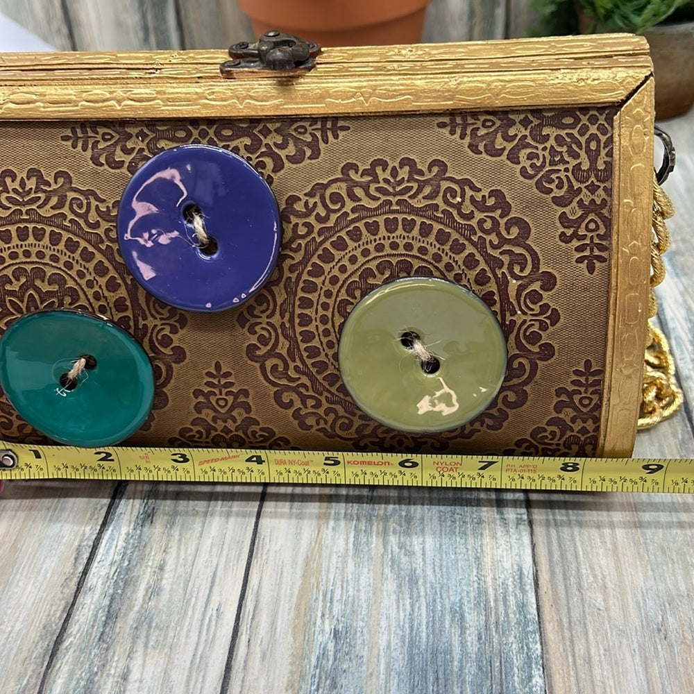 Adorned Crown Altered wood hinged big button gold handle green tassel purse