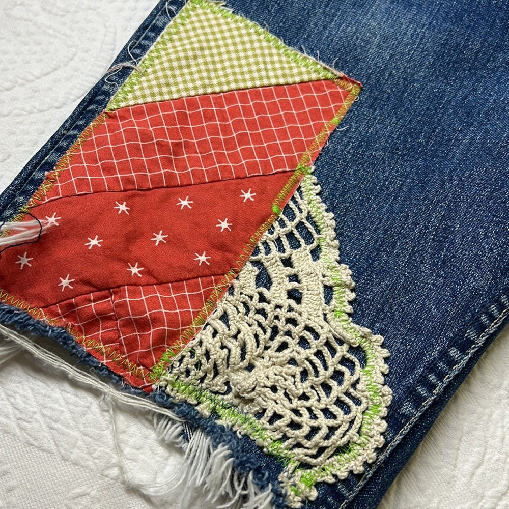 Adorned Crown Textile reworked patch Big E Levi’s cut off shorts upcycle