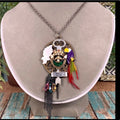 Adorned Crown artisan assemblage jungle toucan bird key cluster necklace