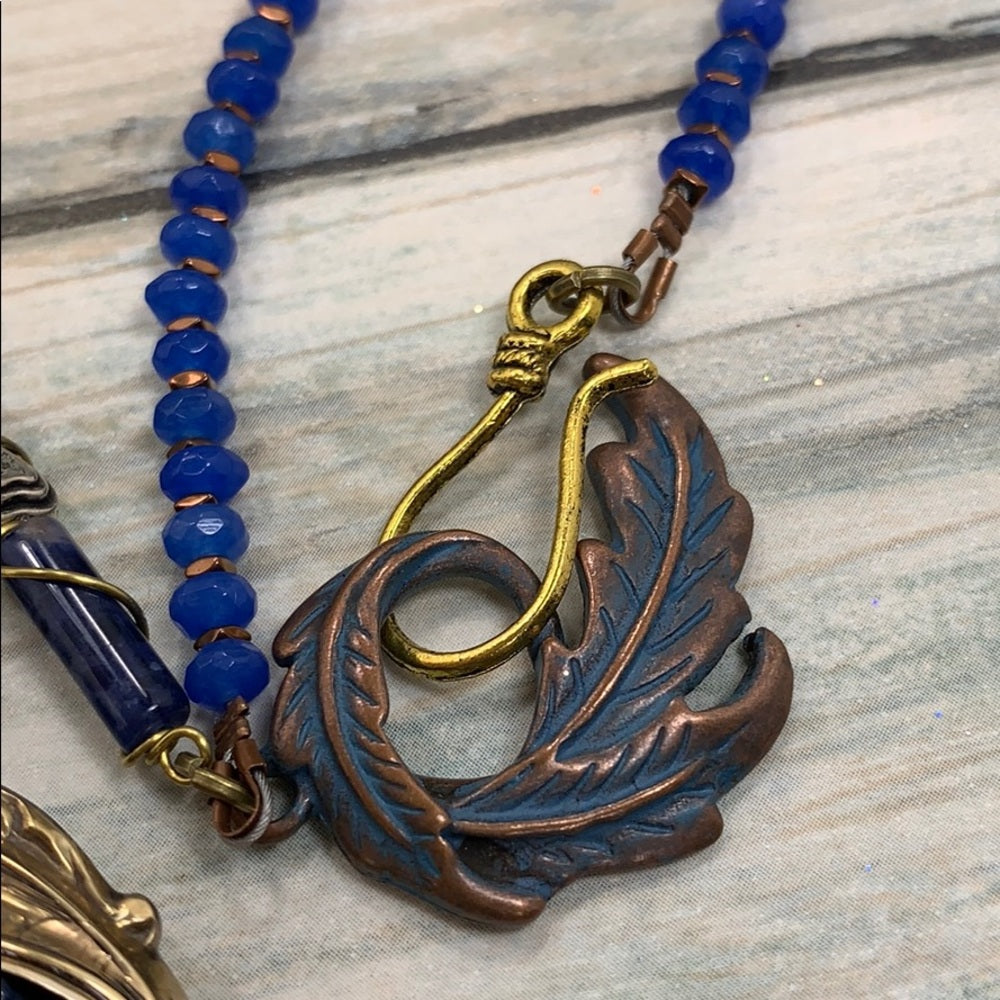 Adorned Crown artisan assemblage gold lapis rhinestone bow necklace