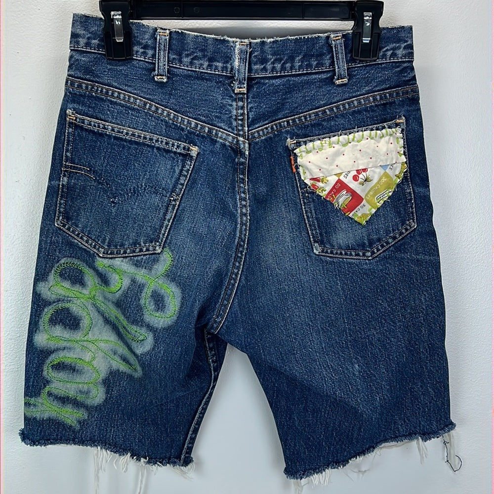 Adorned Crown Textile reworked patch Big E Levi’s cut off shorts upcycle