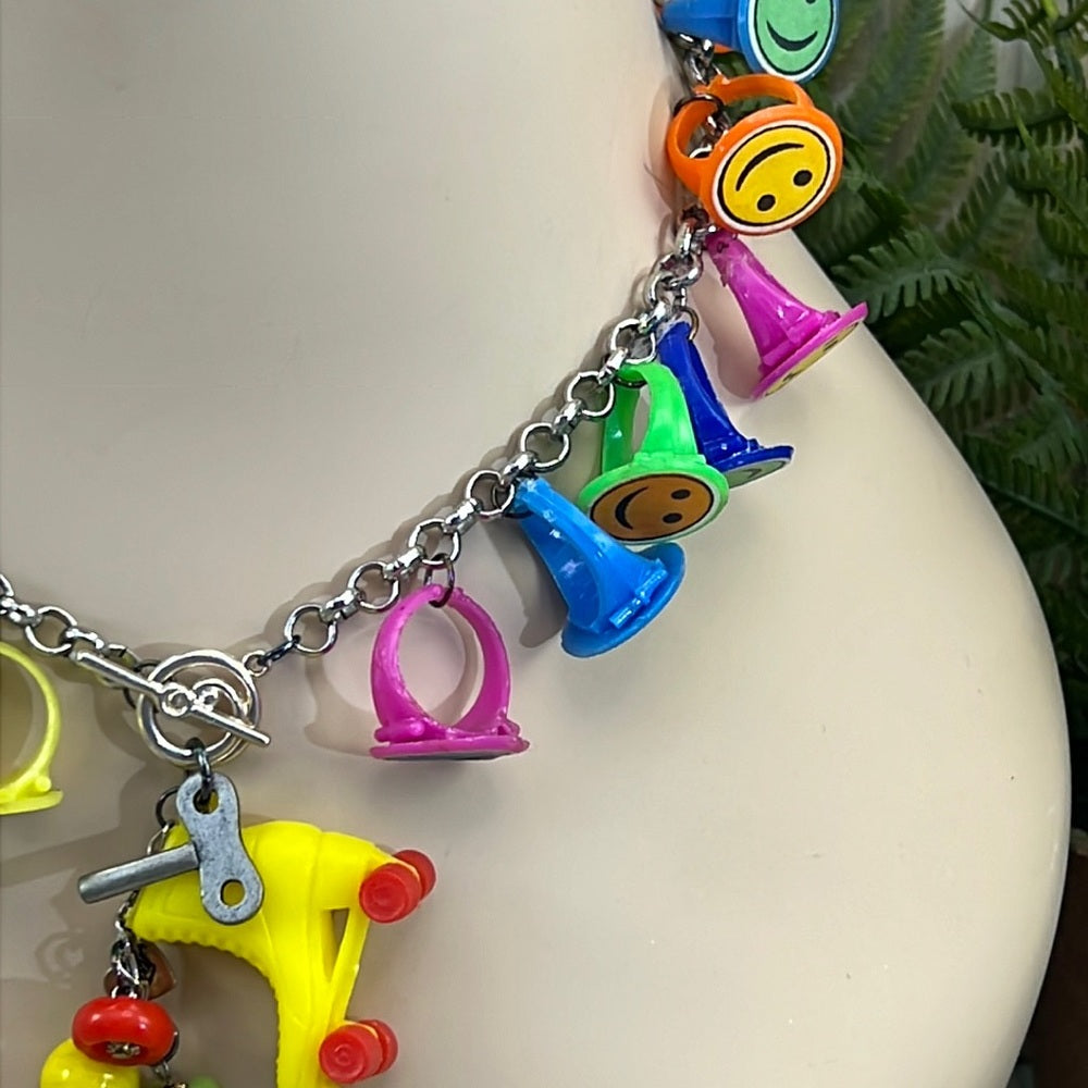 Adorned Crown artisan assemblage child’s roller skate happy face necklace