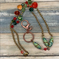 Adorned Crown assemblage orange green bead lanyard keychain badge